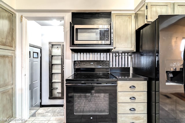 kitchen with light brown cabinets and black appliances