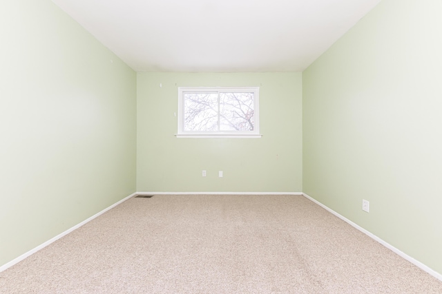 unfurnished room with carpet flooring