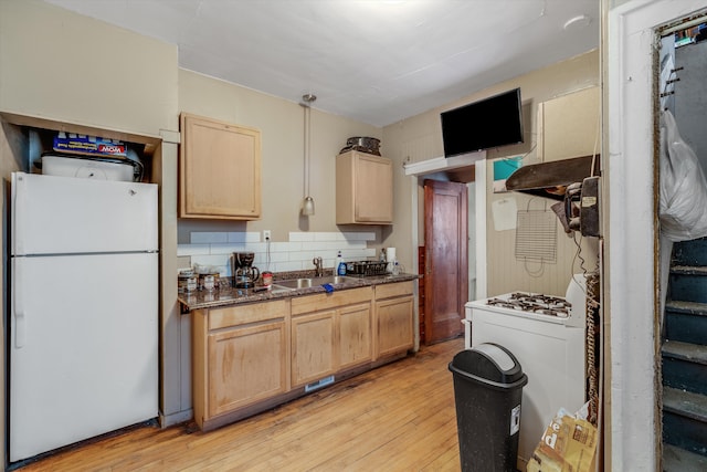 kitchen featuring white refrigerator, light wood-type flooring, and light brown cabinets