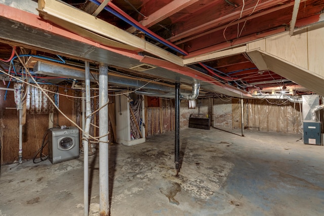 basement featuring washer / clothes dryer and heating unit