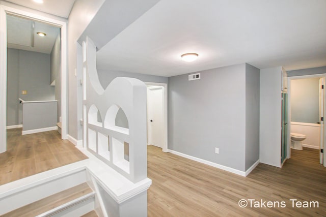 corridor featuring light hardwood / wood-style floors