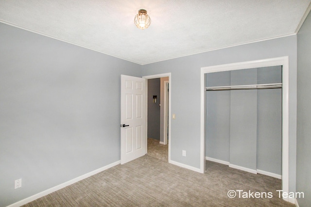 unfurnished bedroom featuring a closet and carpet