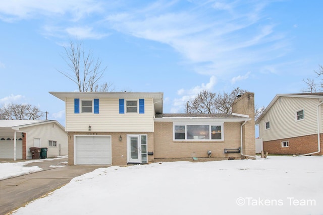 split level home with a garage