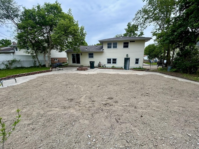 2200 Rossiter Pl, Lansing, MI 48911 - back of property featuring a patio and a fire pit