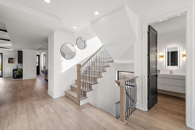 staircase featuring wood-type flooring