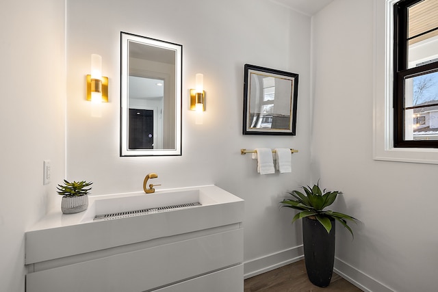 bathroom with vanity and hardwood / wood-style floors