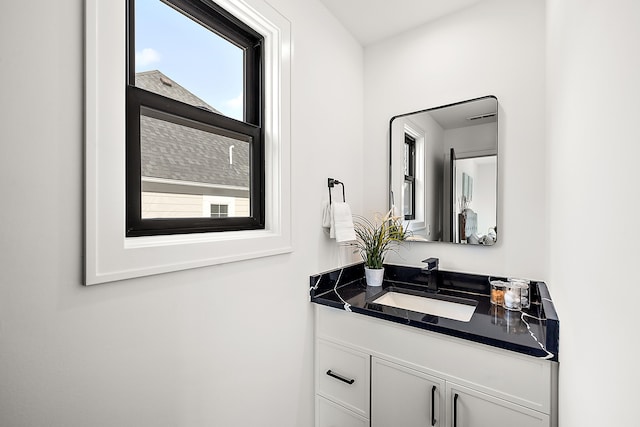 bathroom featuring vanity and plenty of natural light