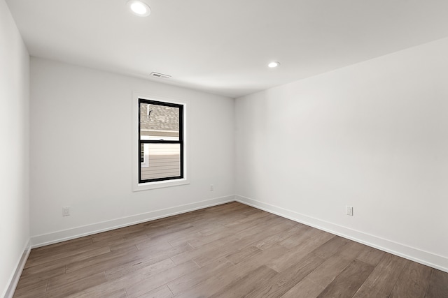 spare room with light hardwood / wood-style floors