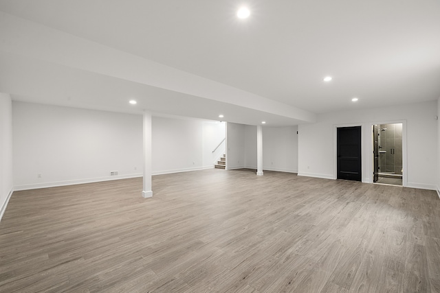 basement featuring light hardwood / wood-style flooring