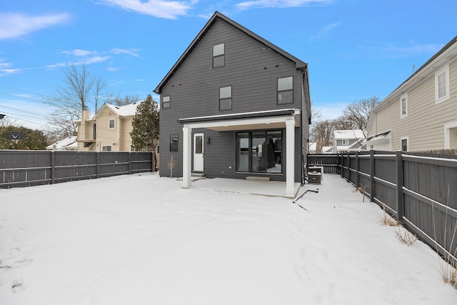 view of snow covered house