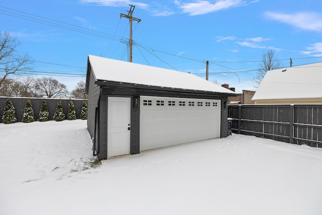 view of snow covered garage