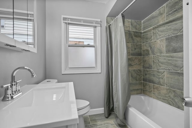 full bathroom with shower / bath combo, vanity, and toilet