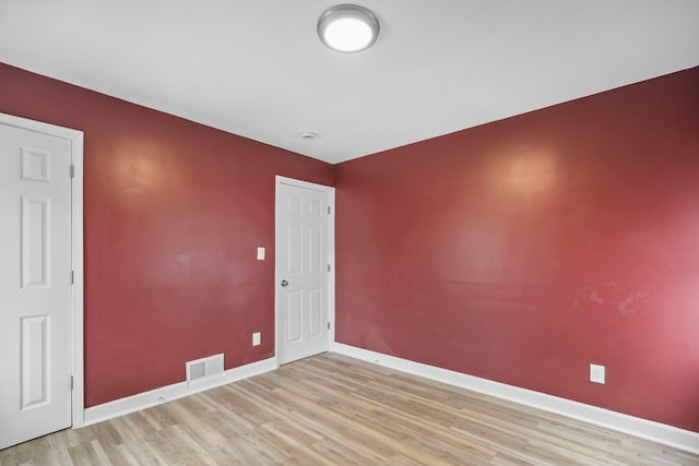 spare room with light wood-type flooring