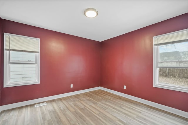 unfurnished room featuring light wood-type flooring