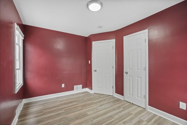 unfurnished bedroom featuring light hardwood / wood-style flooring