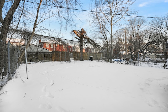 view of yard layered in snow