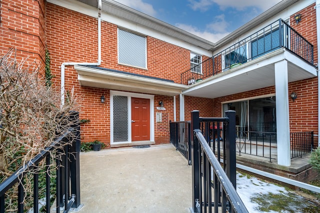 doorway to property featuring a balcony