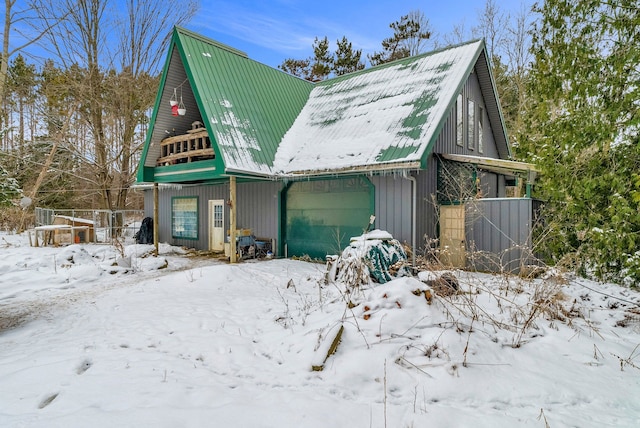 view of snow covered garage