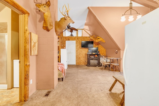 additional living space featuring ceiling fan