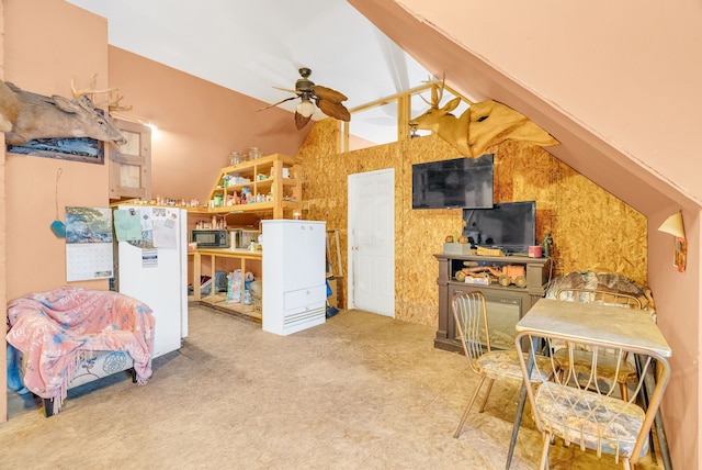 interior space featuring lofted ceiling with beams, white fridge, and carpet