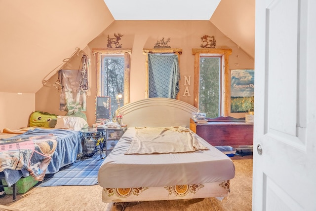 bedroom with lofted ceiling