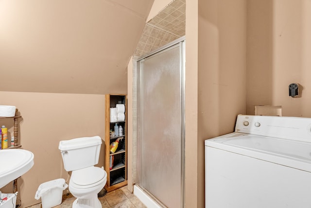 full bathroom featuring lofted ceiling, washer / dryer, toilet, and separate shower and tub