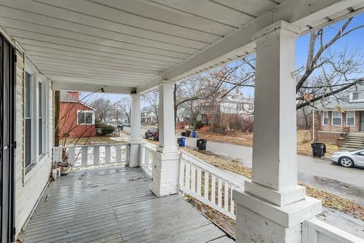 wooden terrace with a porch