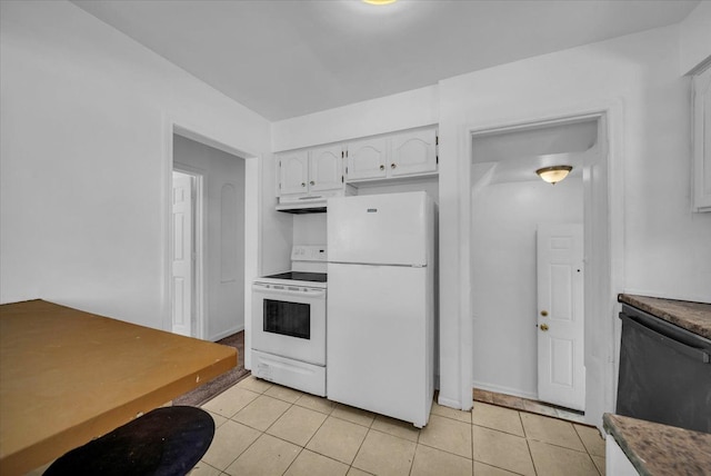 kitchen featuring under cabinet range hood, white appliances, light tile patterned flooring, and white cabinets