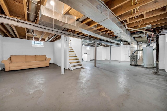 basement with gas water heater, stairway, and heating unit