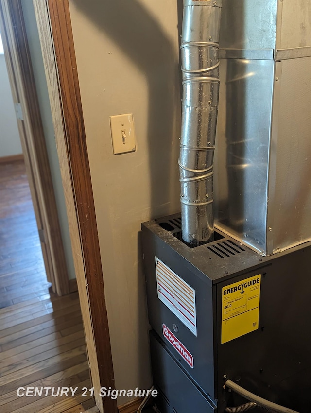 utility room featuring heating unit