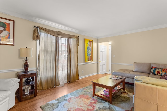 living room with ornamental molding and hardwood / wood-style floors