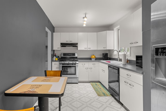 kitchen featuring appliances with stainless steel finishes, sink, and white cabinets