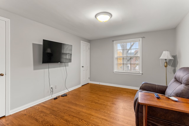 sitting room featuring light hardwood / wood-style flooring