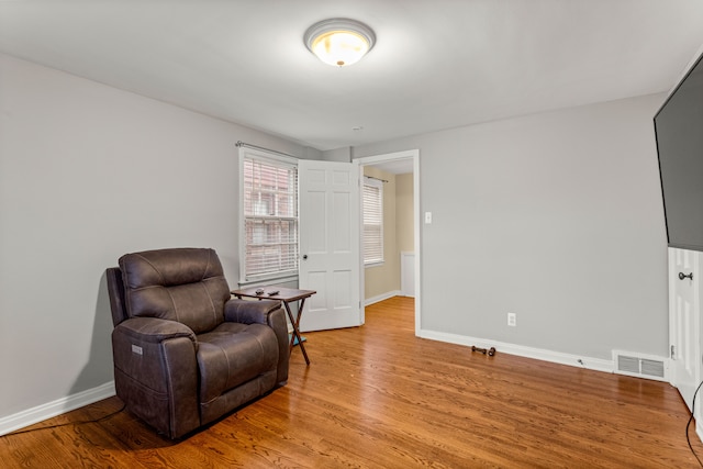 sitting room featuring light hardwood / wood-style flooring