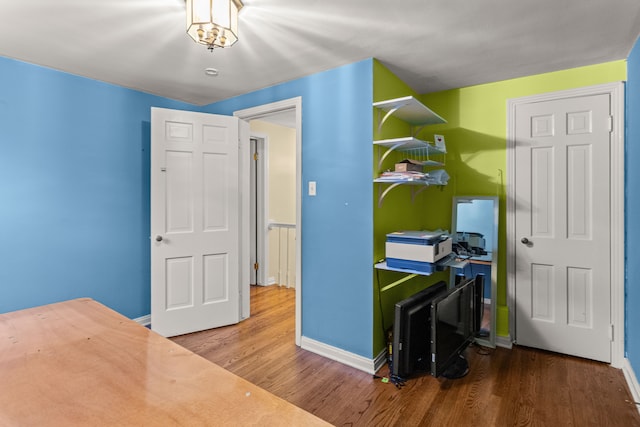 bedroom featuring hardwood / wood-style flooring