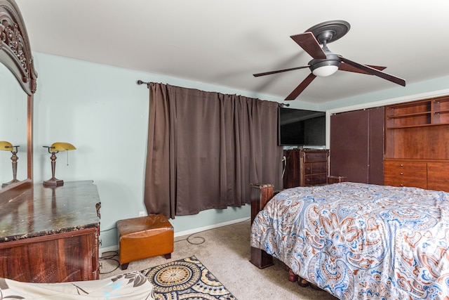 bedroom with ceiling fan and a closet