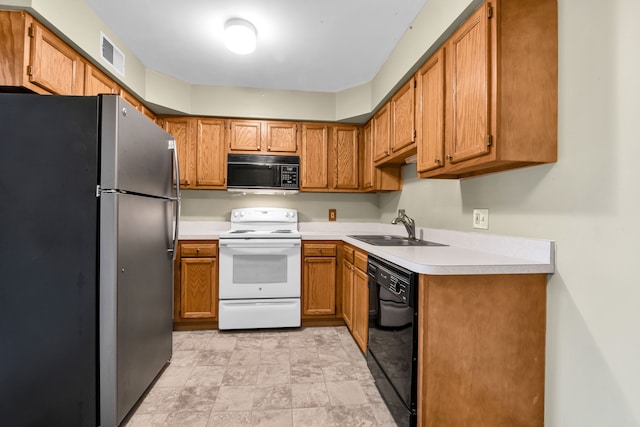 kitchen with sink and black appliances