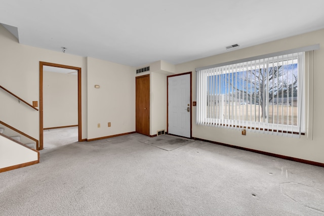 empty room featuring light colored carpet