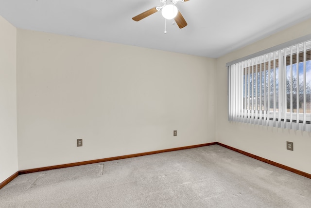 unfurnished room with carpet floors and ceiling fan