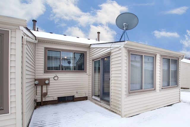 view of snow covered property