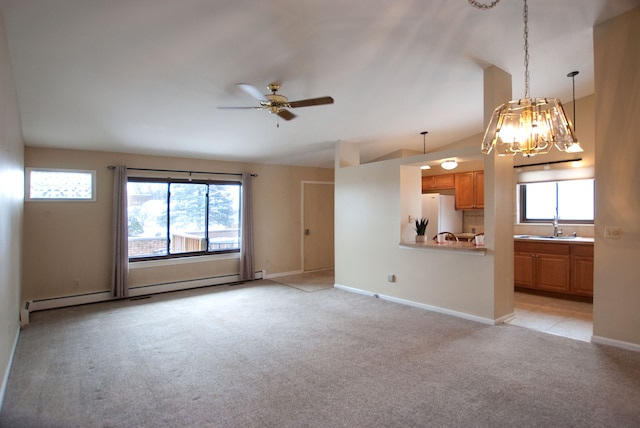 unfurnished living room featuring lofted ceiling, sink, light colored carpet, ceiling fan, and a baseboard heating unit