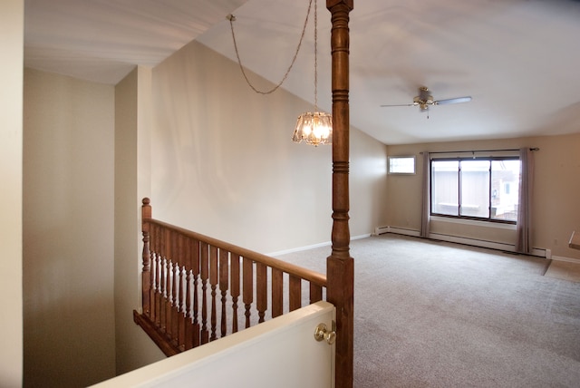 stairs featuring carpet, lofted ceiling, and baseboard heating