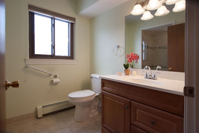 bathroom with vanity, tile patterned floors, toilet, and baseboard heating