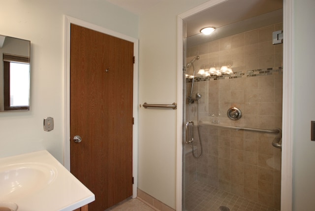 bathroom featuring vanity and a shower with shower door