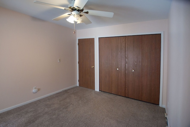 unfurnished bedroom with carpet floors, two closets, and ceiling fan