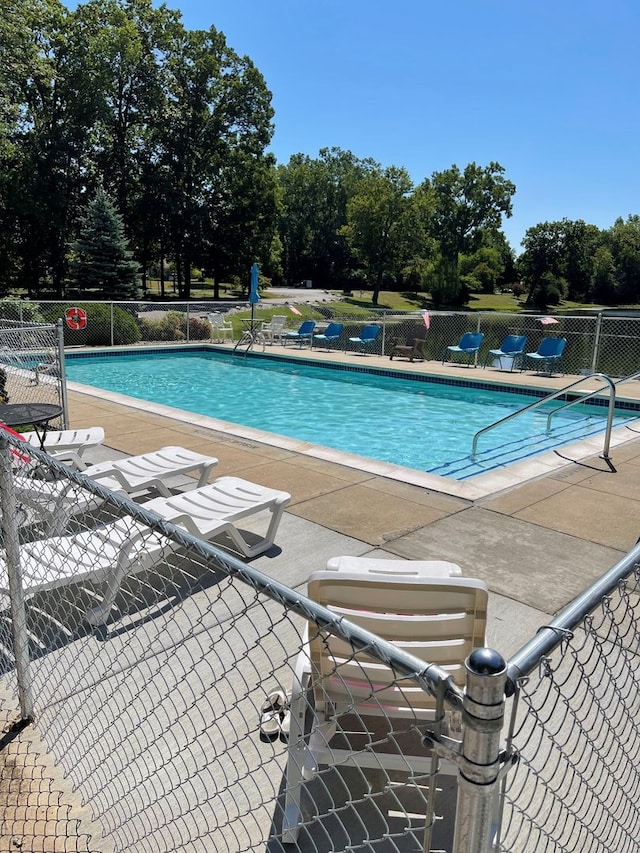 view of swimming pool featuring a patio area