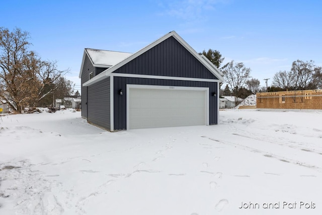 view of snow covered garage