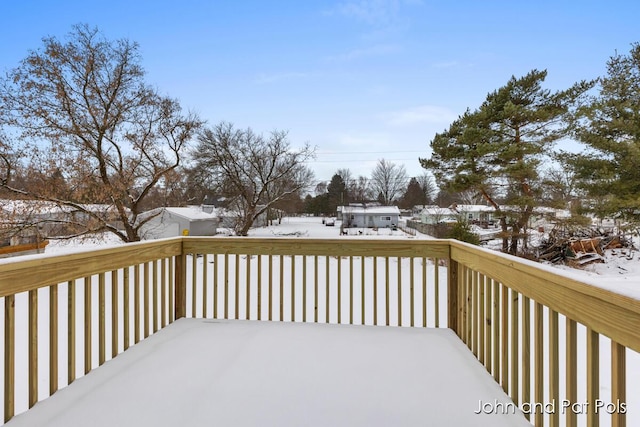 view of snow covered deck