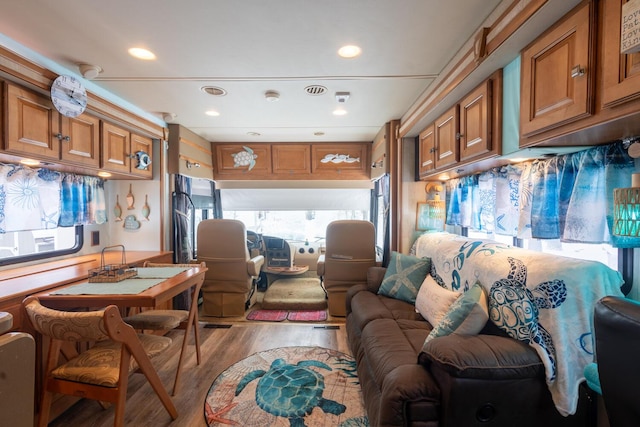 interior space with plenty of natural light and light hardwood / wood-style floors