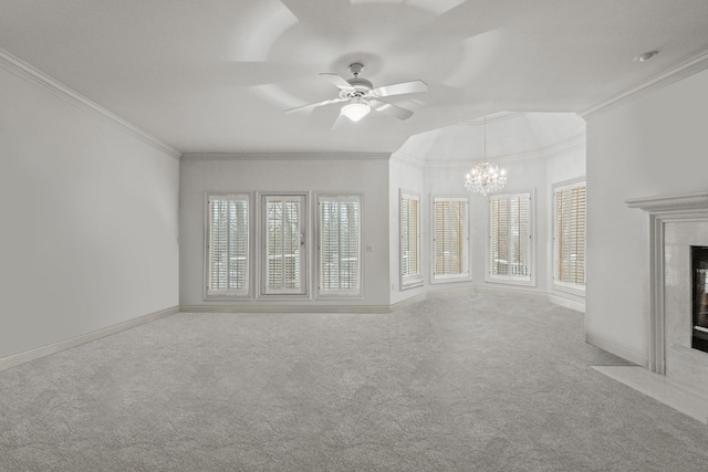 unfurnished living room with light carpet, baseboards, a high end fireplace, crown molding, and ceiling fan with notable chandelier